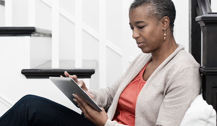 Woman researching Personal Trust Services Administration on tablet